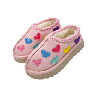 Lola and The Boys Candy Heart Sherpa Booties
Pink children's slippers with colorful heart patterns on a white background