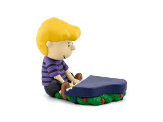 Tonies Character: Peanuts: A Charlie Brown Christmas (Vince Guaraldi Trio)
Toy figure of a boy playing a keyboard on a white background