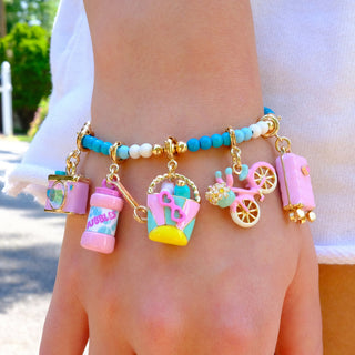 Charm It! Gold Suitcase Charm
Colorful charm bracelet on a wrist with various charms.
