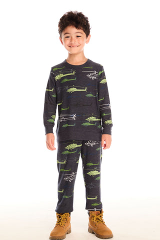Chaser Allover Helicopters Pants
Child wearing a dark gray pajama set with green airplane patterns on a white background