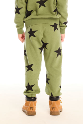 Chaser Allover Stars Green Pants
Green outfit with black star patterns worn by a person on a white background