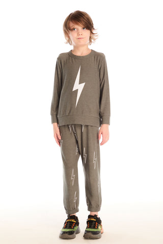 Chaser Bolt Long Sleeve
Child wearing a green outfit with lightning bolt designs on a white background