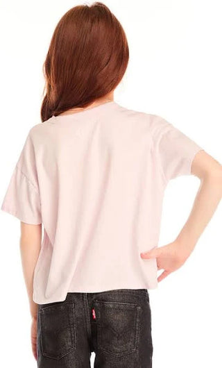 Chaser Love Tee
Person wearing a light pink t-shirt and dark jeans on a white background