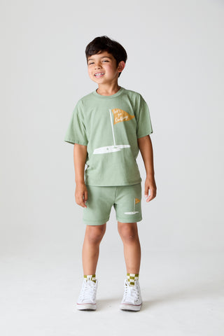 Chaser On The Green Tee
Child wearing a green t-shirt and shorts set with a white background