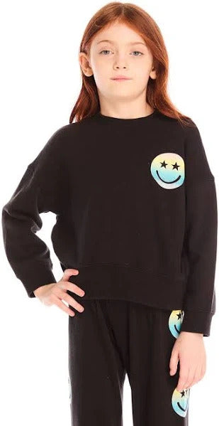 Chaser Pastel Rainbow Smiley Pullover
Child wearing a black sweatshirt with a smiley face design on a white background