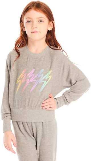 Chaser Rainbow Bolts Pullover
Girl wearing a gray sweater with colorful text design on a white background