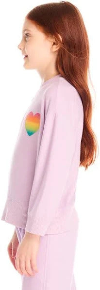 Chaser Rainbow Glitter Heart Pullover
Child wearing a light purple outfit with a rainbow heart design.