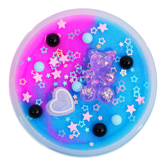 Peachybbies Icee Slime - Cotton Candy Boba Slush
A round, clear plastic tub filled with bright blue and pink slime, decorated with a translucent purple bear-shaped charm, a white glittery heart, black and light blue beads, and pastel star-shaped sprinkles.