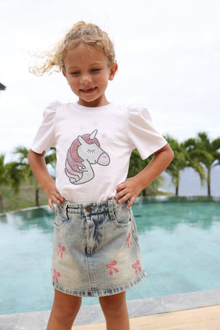 Lola & The Boys denim skirt featuring colorful bow accents, stylish design, and a classic A-line silhouette.