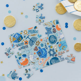 Jollity & Co Festival of Lights Mini Puzzle 
Hanukkah-themed puzzle with coins on a light blue background