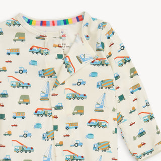 Magnetic Me Dumps Like A Truck Modal Footie
Children's long-sleeve shirt with truck pattern on a white background
