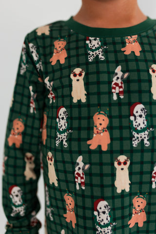 In My Jammers Christmas Pups Two Piece Set
Green checkered shirt with dog pattern worn by a person