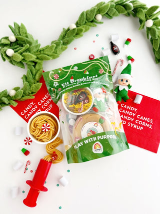 EGKD Earth Grown KidDoughs Elf Breakfast KidDough Play Kit Elf on the Shelf playset with candy-themed packaging on a white background with green wreath.
