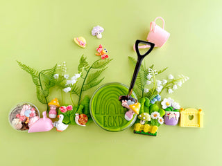 EGKD  Earth Grown KidDoughs Garden KidDough Play Kit
Miniature garden set with plants, flowers, and gardening tools on a green background