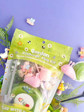 EGKD  Earth Grown KidDoughs Garden KidDough Play Kit 
Garden-themed play kit packaging with green play dough and tools on a purple background