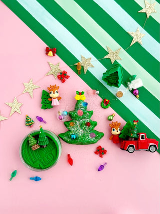 EGKD Earth Grown KidDoughs Trim A Tree KidDough Play Kit
Colorful Christmas-themed playdough set with green playdough, toys, and decorations on a striped background.