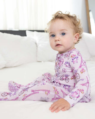 Lev Baby Emilia ruffled zippered footie for babies, featuring soft fabric and adorable ruffle details in a cozy one-piece design.