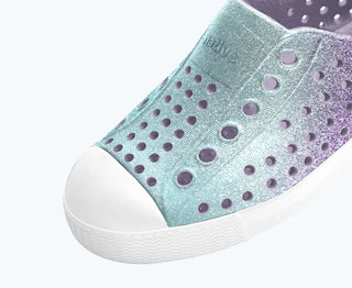 Native Jefferson Bio-Bling Fresco Twirling Bling shell white shoes with shiny, decorative accents and a casual, stylish design.