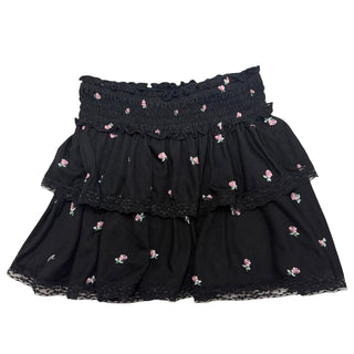 FBZ Ditsy Floral Black Lace Trim Skirt
A black tiered ruffle skirt with small pink rose embroidery and lace trim, shown flat against a white background.