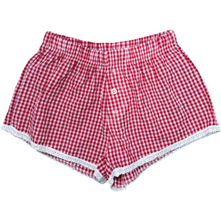 FBZ Red Gingham Lace Trim Shorts
Red and white checkered shorts with lace trim on a white background