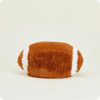 Football Warmies
Fluffy brown and white football-shaped pillow on a light beige background