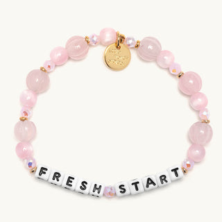 Little Words Project Bracelet - Fresh Start
Pink beaded bracelet with 'Fresh Start' charm on a white background
