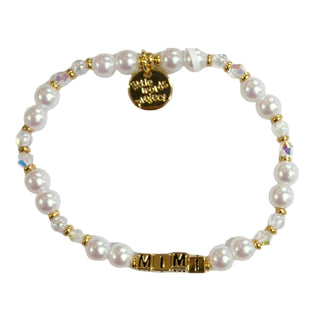 Little Words Project Bracelet - Gold Mimi Custom Moonlit Love
A beaded stretch bracelet featuring white faux pearls, iridescent crystal beads, and gold-toned spacer beads, with a gold-toned circular charm and a gold-toned 'MIMIM' nameplate clasp, shown on a plain white background.