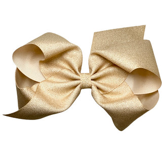 King Wee Ones Champagne Glitter Grosgrain Hair Bow on Clippie Beige hair bow on a white background