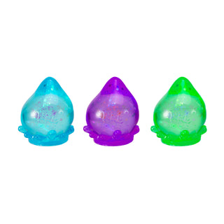 Schylling NeeDoh Galactic Glow Dream Drop toy with glowing, colorful, slime-like substance in a playful container.