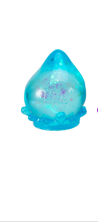 Schylling NeeDoh Galactic Glow Dream Drop toy with glowing, colorful, and textured slime-like substance for sensory play and relaxation.