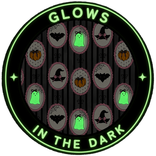 Caden Lane Girl's Two Piece Flare Lounge Set - Glow in the Dark Galloween
A circular Halloween-themed graphic with the words 'GLOWS IN THE DARK' in glowing green text. The center shows a repeating pattern of dark gray and black vertical stripes with oval motifs containing pumpkins, ghosts, bats, and witch hats.