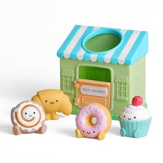 Itzy Ritzy Itzy Play™ Put & Take Toy - Bakery
Toy bakery set with a green and blue building and colorful toy food items on a white background