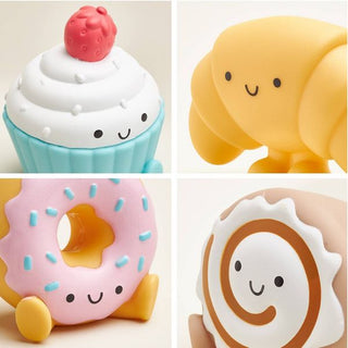 Itzy Ritzy Itzy Play™ Put & Take Toy - Bakery
Four cute silicone food-shaped toys arranged in a grid on a light background.
