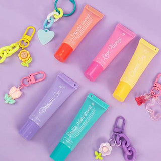 Gen Me Create Lip Gloss Charm Kit
Colorful lip balm tubes and keychains on a purple background