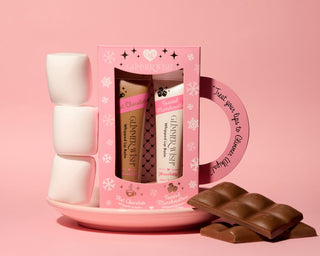 Glimmer Wish Hot Chocolate and Toasted Marshmallow Glimmer Whip Duo
Pink gift set with lip balm and chocolate on a pink background