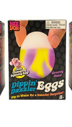 Groovy Haze NeeDoh Dippin Dazzler
Three boxes of Dippin' Dazzler Eggs with colorful egg-shaped objects on a white background.