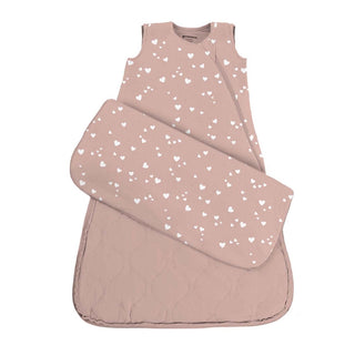 Gunamuna Sleep Sack 1.0 TOG - Hearts
A baby sleep bag set in dusty rose pink with a white heart pattern, featuring a matching padded pillow and a quilted footed base, shown on a plain white background.