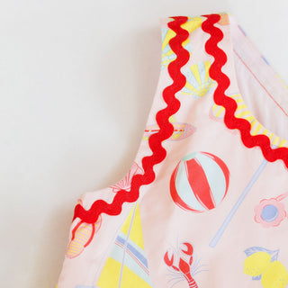 Hollis Baker Millie Dress for Beach Days, lightweight summer dress with floral print, worn by a girl on the beach.