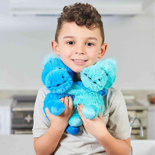 Warmies Dinosaur Hugs
Child holding a blue plush toy in a kitchen setting