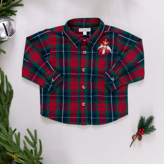 Blue Rooster Boys Jack Shirt - Red Tartan
Red and green plaid shirt with a brooch on a white background with Christmas decorations.