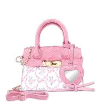 Pink handbag with floral pattern and heart design on a white background