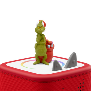 Tonies Character: Dr. Seuss: How The Grinch Stole Christmas!
Toy figure of a green character with a red hat on top of a red toy box with shark fins.