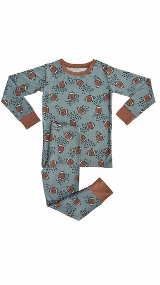 In My Jammers Green Football Two Piece Set
Children's pajama set with football pattern on a white background