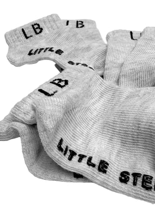 Little Bipsy Ankle Sock 3 Pack - Light Heather Grey
Gray socks with 'LB' and 'LITTLE STEPS' text on a white background