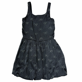 FBZ Silver Bow Black Bubble Dress
Black romper with bow pattern on a white background