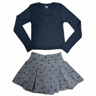 FBZ Grey with Tiny Black Bows Skort
FBZ Bow Ribbed Long Sleeve Black Tee
Navy long-sleeve top with bow and gray skirt with black patterns on a white background