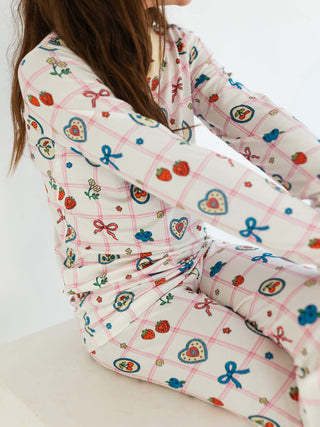 In My Jammers Two Piece Set - Sweet Plaid
Person wearing a patterned outfit with colorful designs on a white background