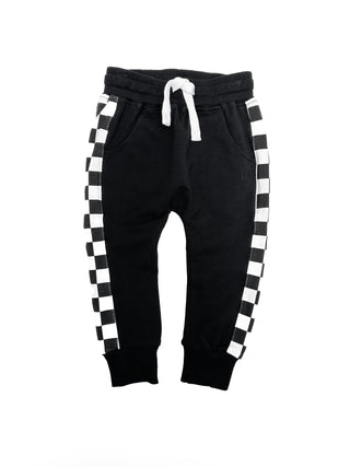 Little Bipsy Stripe Checkered Jogger - Black
Black jogger pants with white and black checkered side panels on a white background