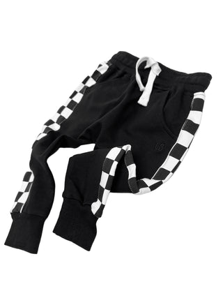 Little Bipsy Stripe Checkered Jogger - Black
Black and white checkered children's outfit on a light gray background