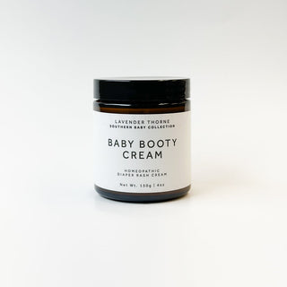 Lavender Thorne Baby Booty Cream moisturizer jar with lavender-themed packaging and white lid, designed for gentle skin care.